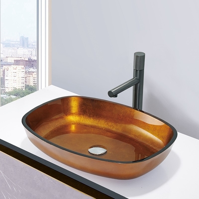 L'oro della stagnola ha temperato i lavabi che di vetro la nave del bagno di forma del melone della ciotola di vetro affonda